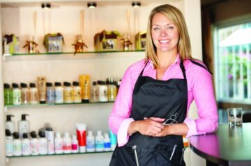 Woman working in hairdressing salon