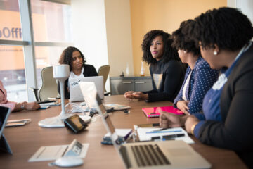 Canva - Four Woman at the Conference Room