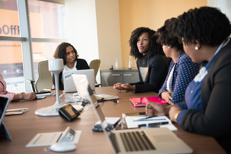 Canva - Four Woman at the Conference Room