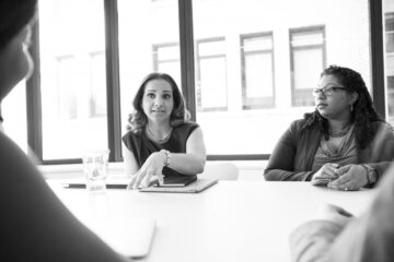 Canva - Photo of Four People Having Conversation in Room