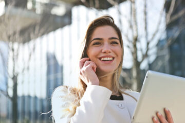 Canva - Woman In White Blazer Holding Tablet Computer