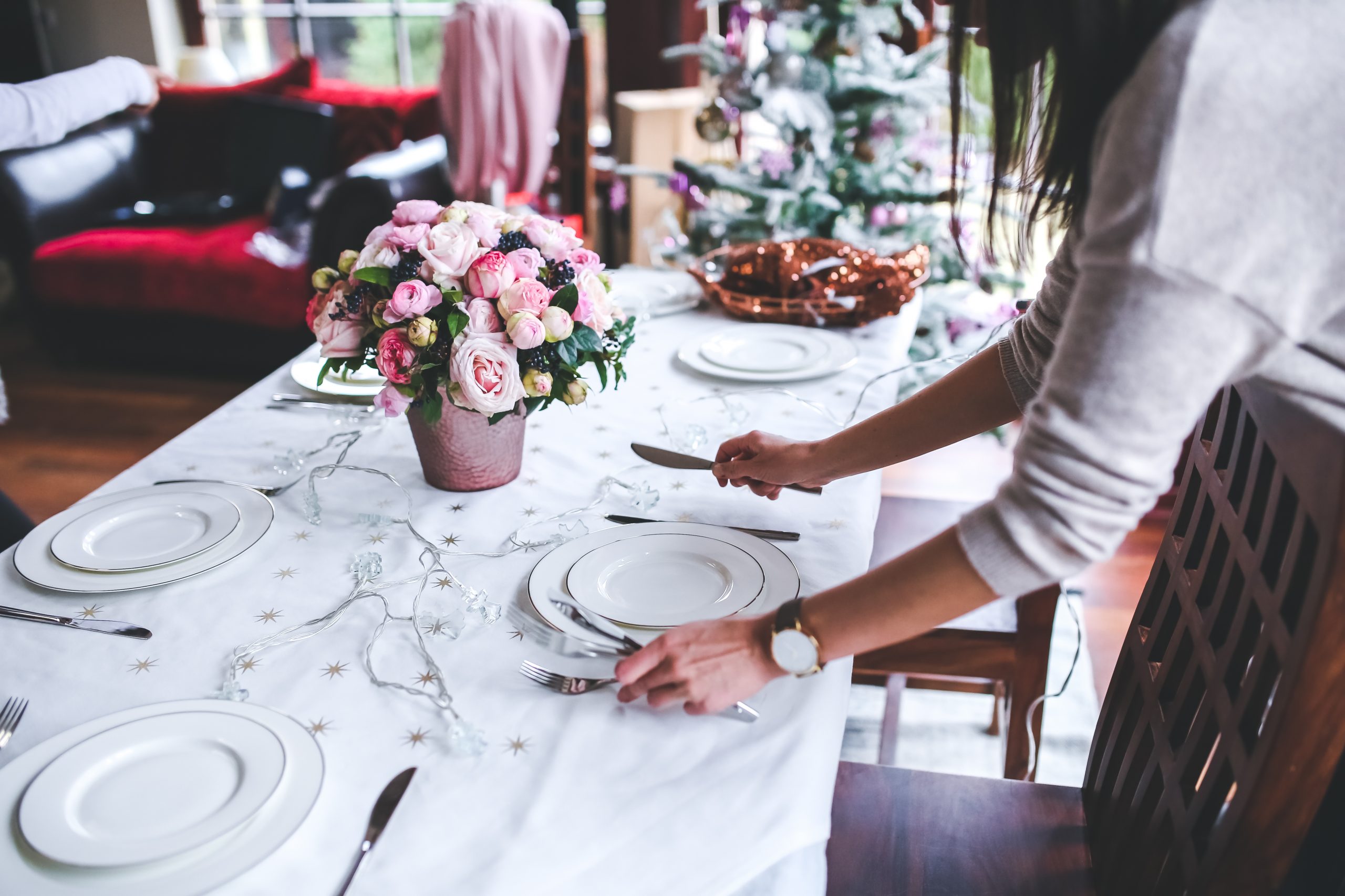 Canva - Woman Preparing Christmas Table