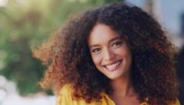 Now is a good time to enjoy life. Cropped shot of a beautiful young woman standing outdoors.