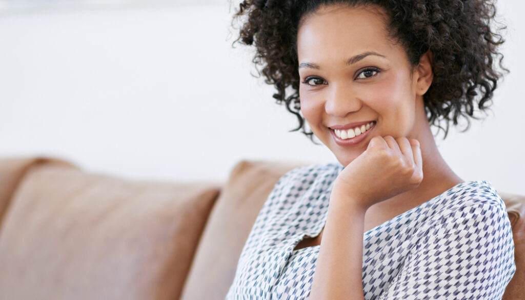 Nowhere more relaxing than home. Portrait of an attractive woman sitting on the sofa with her smartphone. Nowhere more relaxing than home. Portrait of an attractive woman sitting on the sofa with her smartphone.