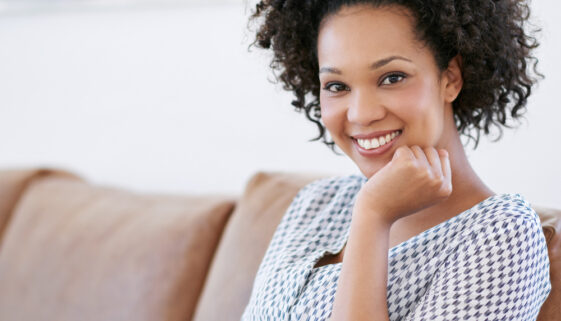 Nowhere more relaxing than home. Portrait of an attractive woman sitting on the sofa with her smartphone.