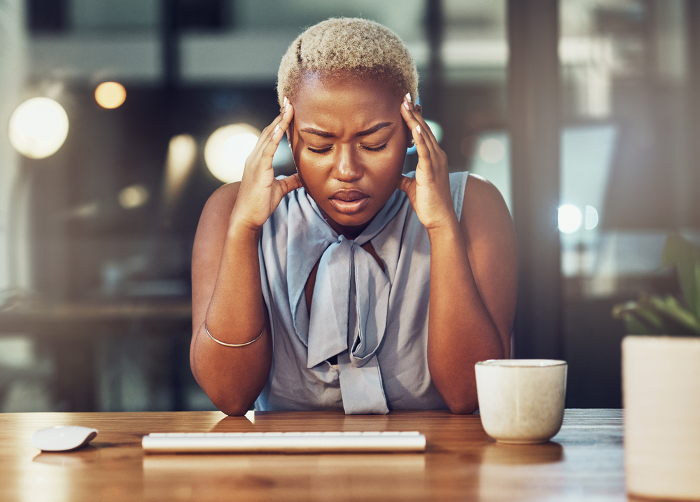 Mental health, stress headache and black woman with burnout from overtime office work. Night fatigue, migraine and frustrated business person, sad consultant or agent with depression, pain or problem