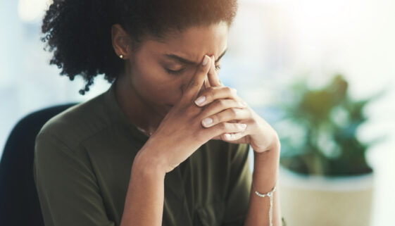 Burnout, stress and business woman in office with problem, mistake and working on deadline. Headache, anxiety and African female worker with frustrated, stressed out and migraine thinking of solution