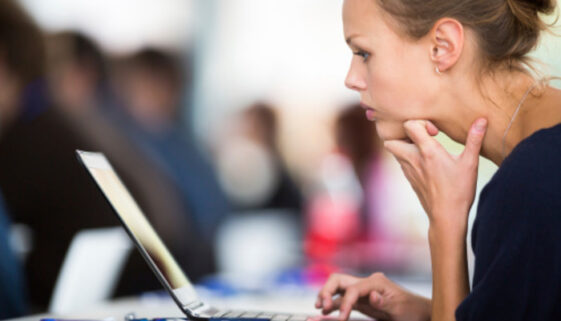 Thoughtful woman laptop