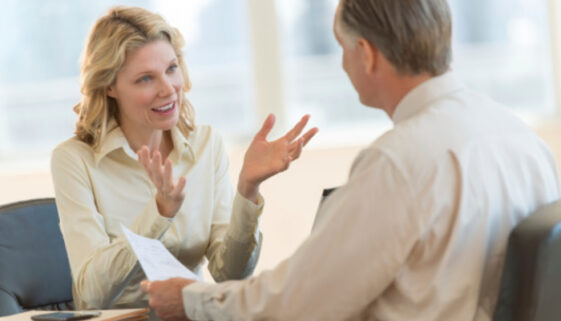 Woman talking with man