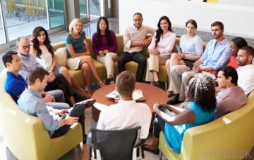 group-of-seated-people-in-a-circle