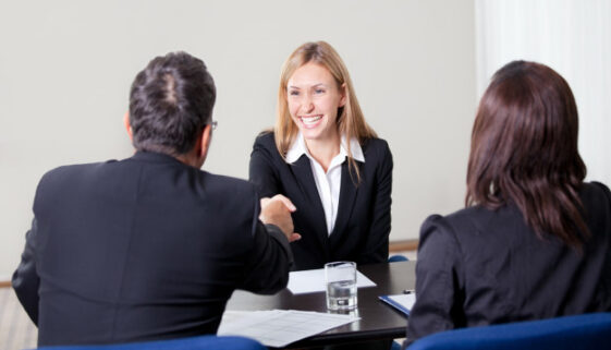 happy woman at table with others