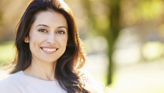 Portrait Of Attractive Hispanic Woman In Countryside