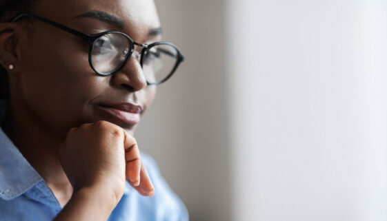Closeup Indoor Portrait Of Black Female Business Analyst In Eyeglasses, Side View