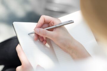 woman writing in journal