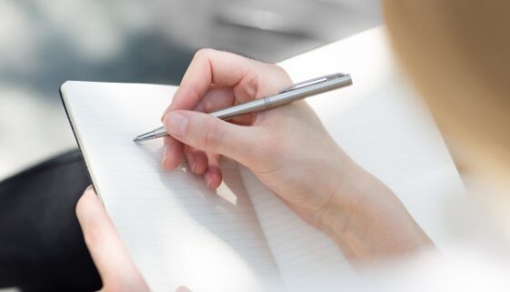woman writing in journal